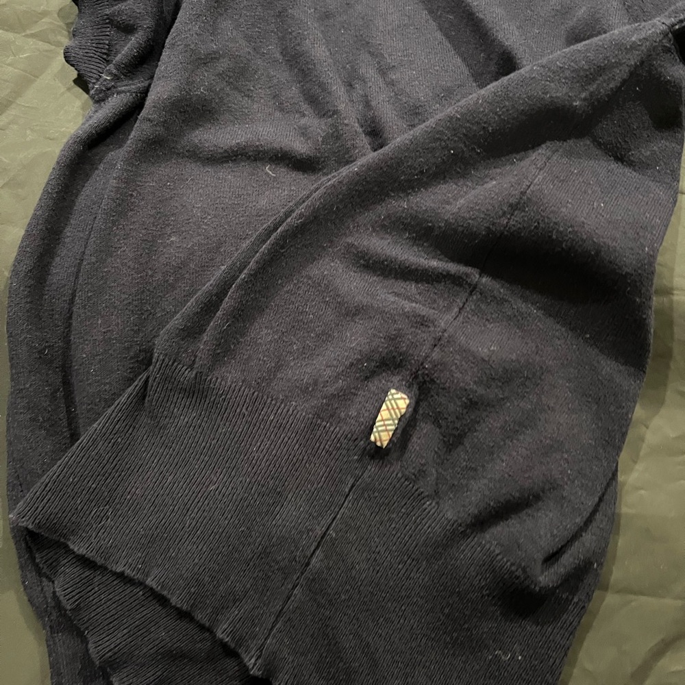 Burberry top size small has some tears look a t the pictures navy blue